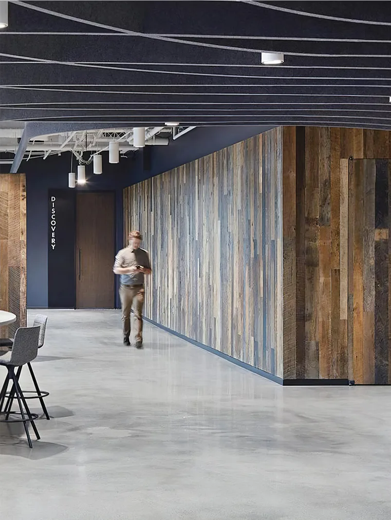 Supplier-provided workplace visualization with wood wall treatment and dark ceiling elements